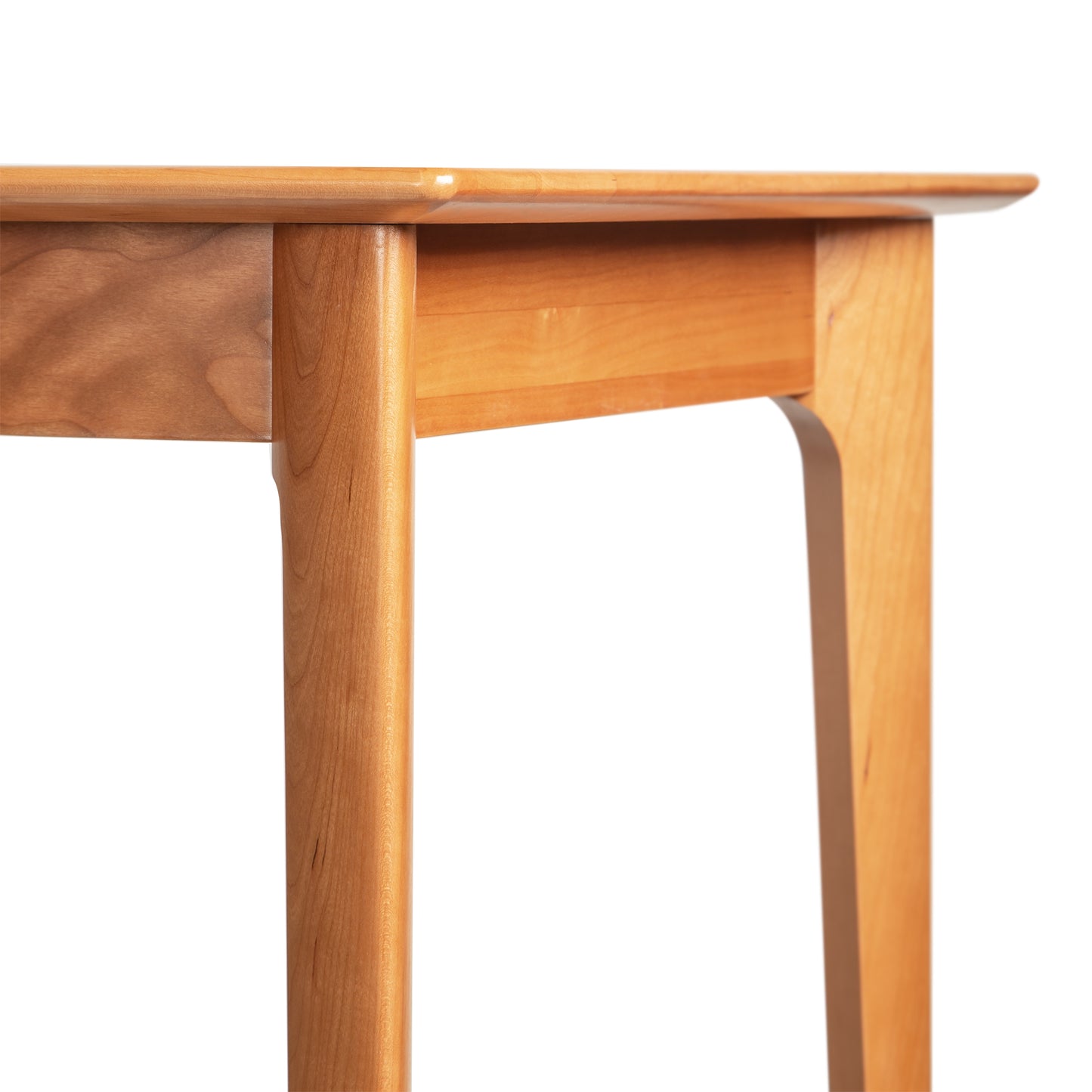 Close-up of Copeland Furniture Sarah Return with Keyboard Tray, highlighting the elegant light brown wood grain and fine craftsmanship.