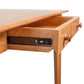 Copeland Sarah Secretary Desk in Shaker style, highlighting its solid wood craftsmanship, metal drawer slides, and classic wood knobs.