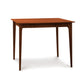 A Sarah Secretary Desk with a wooden top and legs. Brand: Copeland Furniture.