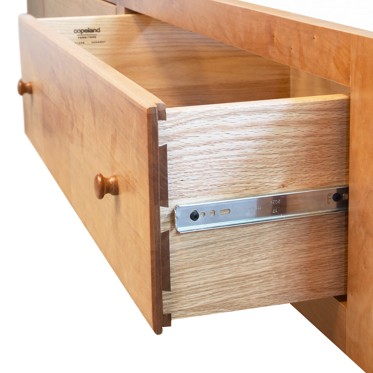 Copeland Sarah Sleigh Storage Bed in solid wood with sleek lines, highlighting quality Vermont craftsmanship and convenient built-in storage drawers.