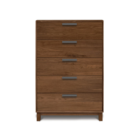 Savoy 5-Drawer Wide Chest by Copeland Furniture features sleek metal handles and short legs, showcasing fine American craftsmanship.