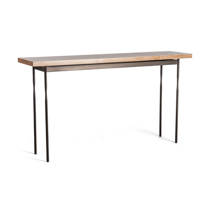 The Hubbardton Forge Senza Wood Top Console Table showcases a minimalist design with a Vermont maple wood top and elegant, handcrafted steel legs, making it perfect for various interior settings.