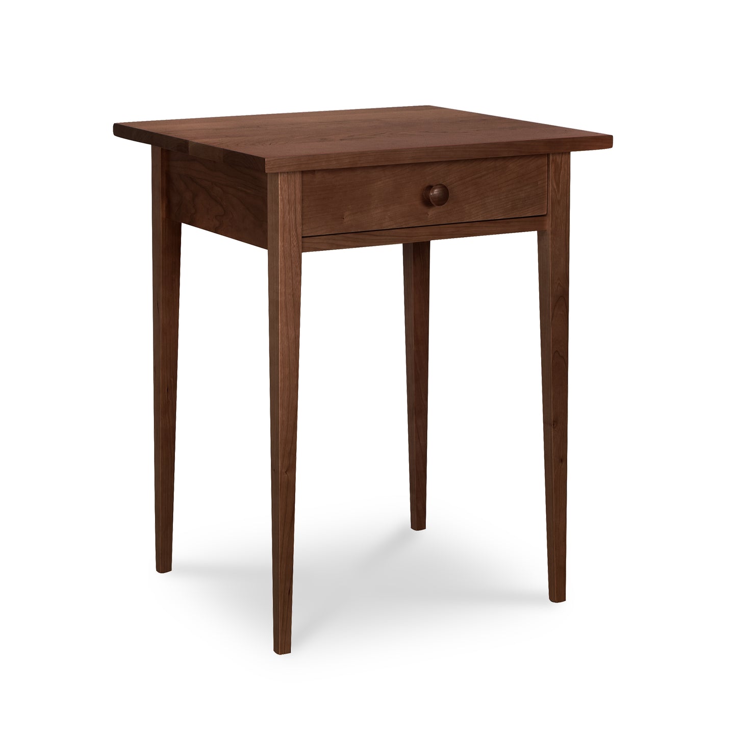 Lyndon Furniture Shaker 1-Drawer Nightstand crafted from solid wood with a single drawer and tapered legs, highlighting its classic Shaker design.