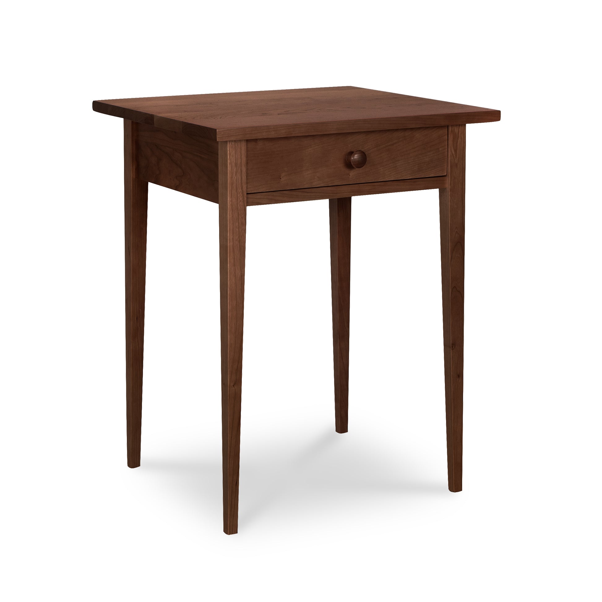 Lyndon Furniture Shaker 1-Drawer Nightstand crafted from solid wood with a single drawer and tapered legs, highlighting its classic Shaker design.