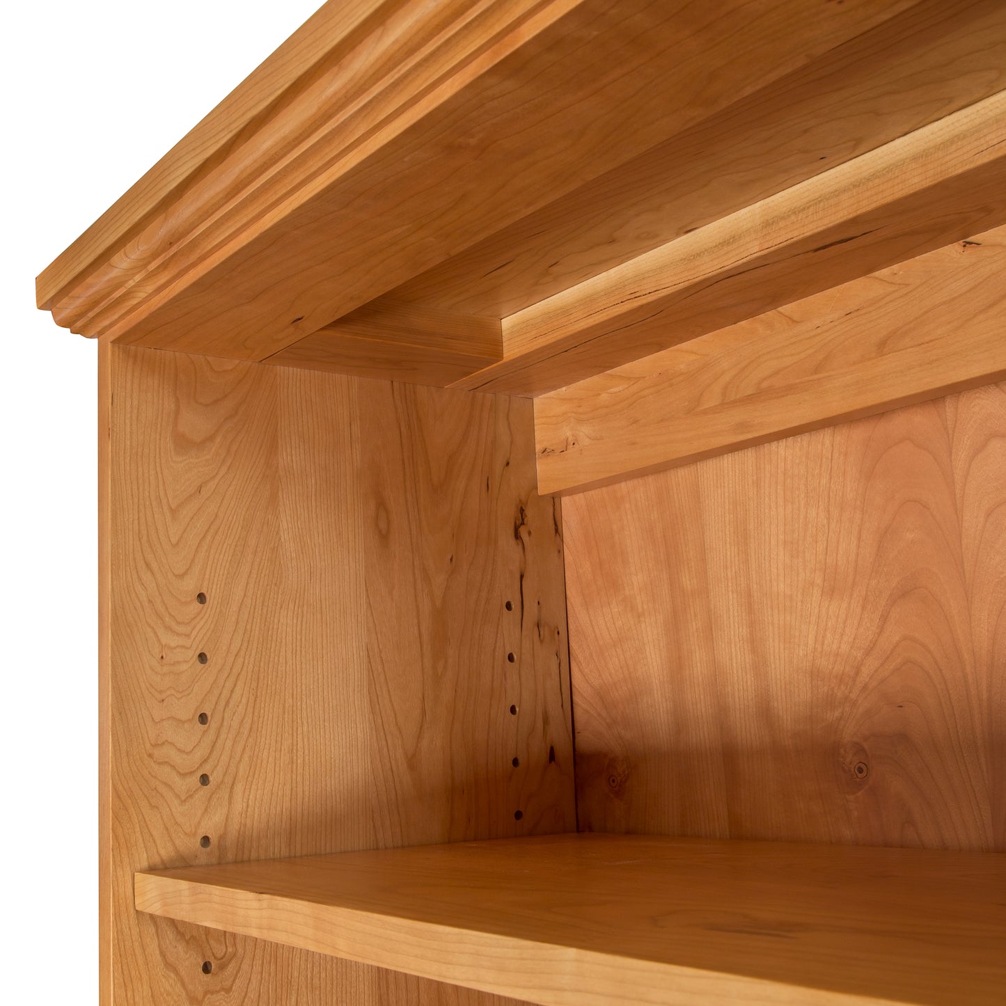 A close up of a Lyndon Furniture Shaker Bookcase with shelves.