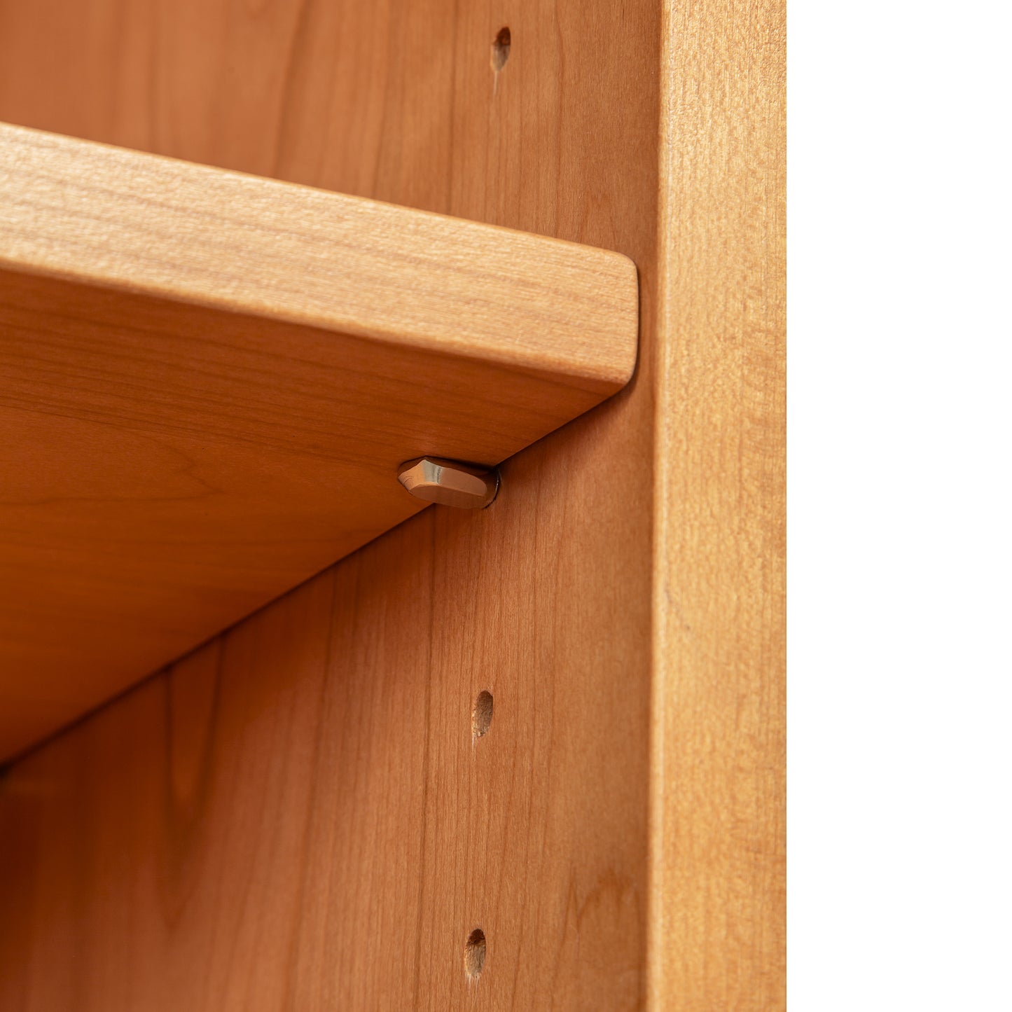 Lyndon Furniture Shaker Bookcase shelf with metal peg, showcasing fine Vermont craftsmanship and adjustable shelf support.