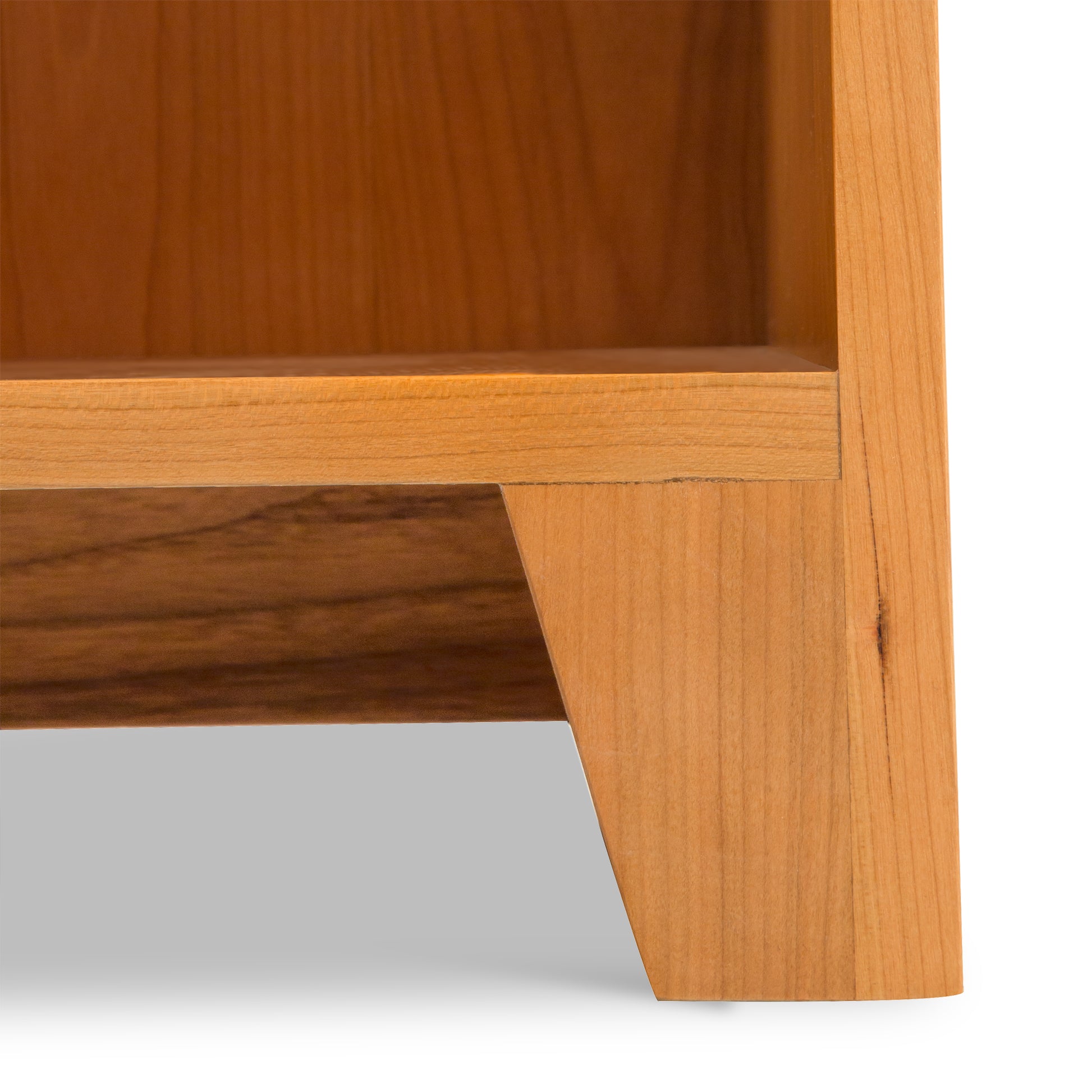 Close-up of Lyndon Furniture Shaker Bookcase leg and frame in natural finish, highlighting quality craftsmanship and wood grain.