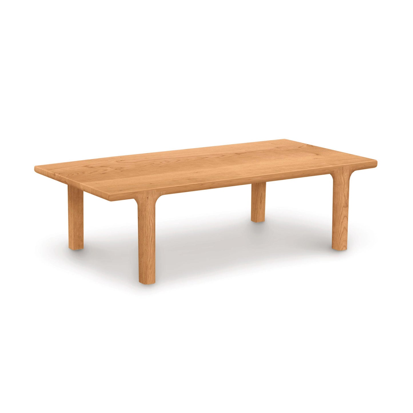A simple Copeland Furniture Sierra Rectangular Coffee Table made from solid North American hardwood with four legs on a white background.