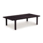 A Copeland Furniture Sierra Rectangular Coffee Table, crafted from North American hardwood, with rounded edges and four legs, isolated on a white background.