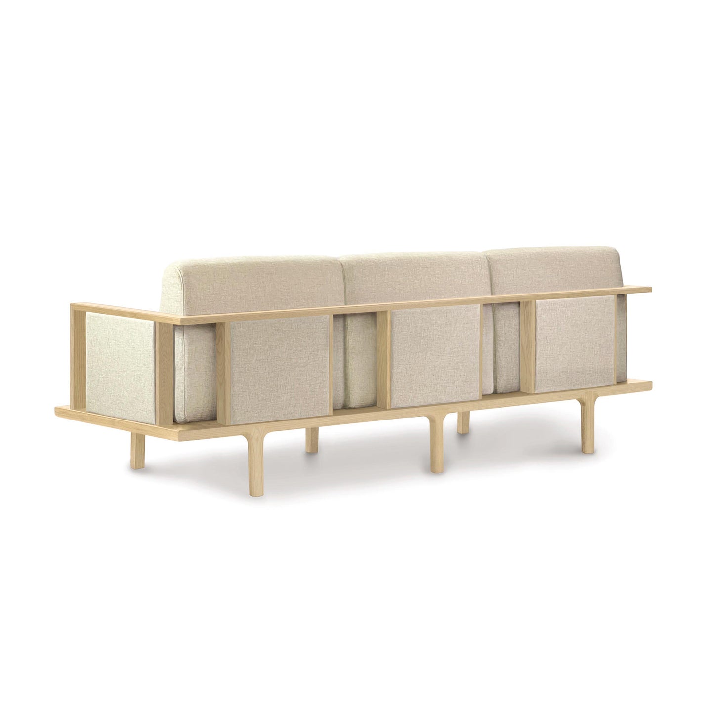 Contemporary design Sierra Oak Upholstered Sofa with Upholstered Panels from Copeland Furniture, with beige cushions, isolated on a white background.