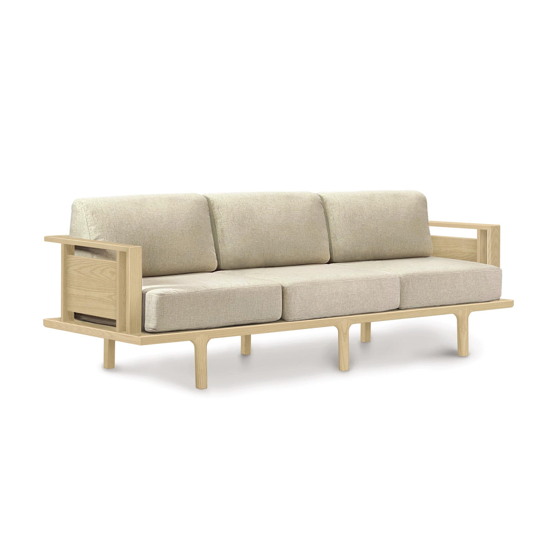 A Copeland Furniture Sierra Oak upholstered sofa with beige cushions.