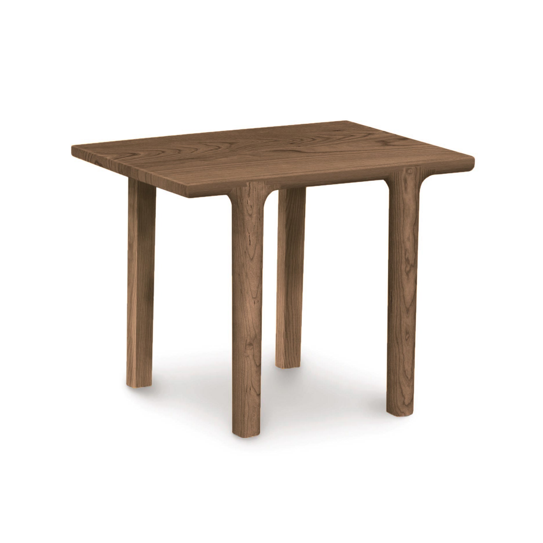 The Copeland Furniture Sierra Rectangular End Table is a modern wooden table with legs, perfect for adding a touch of personality to any seating arrangement.