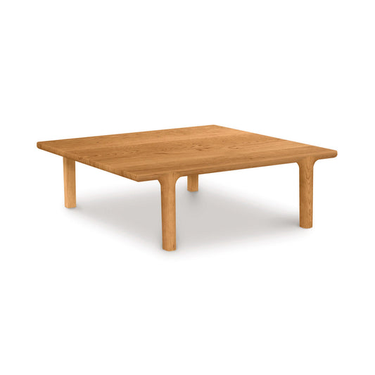 A simple Copeland Furniture Sierra Square Coffee Table crafted from North American hardwood, with a square top and four legs, isolated on a white background.