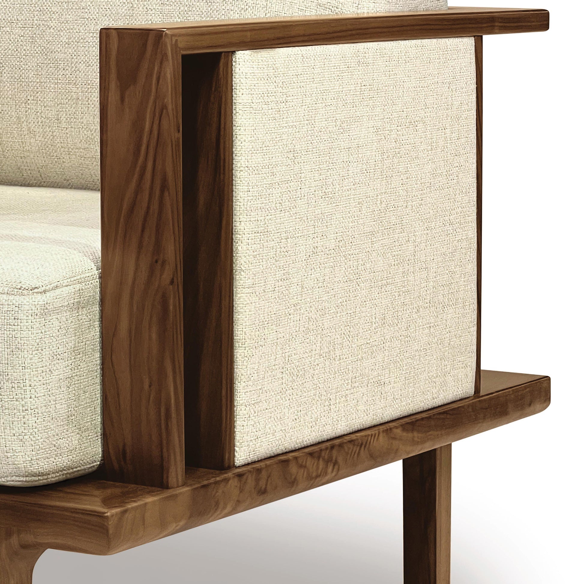 The Sierra Walnut Upholstered Chair with Upholstered Panels by Copeland Furniture features a modern design with a wooden frame and beige fabric on its upholstered panels.