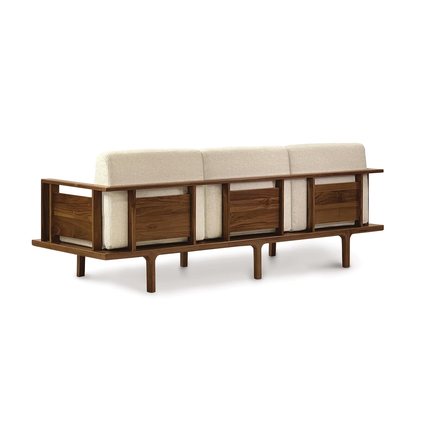A modern wooden three-seater Copeland Furniture Sierra Walnut Upholstered Sofa with a white cushioned seat and back, featuring storage compartments on its sides.