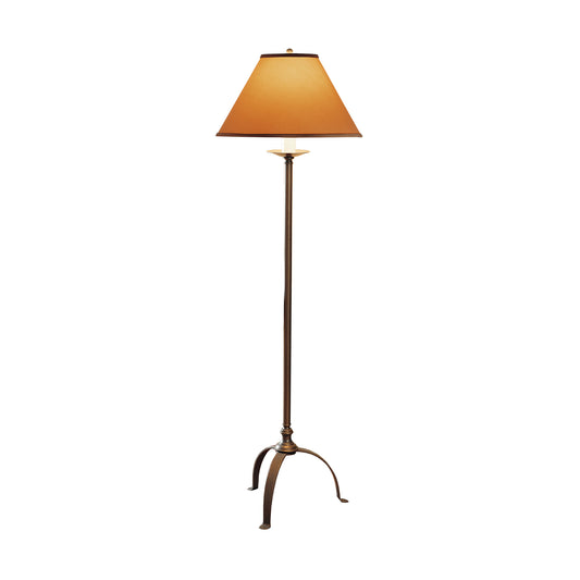 A tall Hubbardton Forge Simple Lines Floor Lamp with an elegant bronze finish and three curved legs, topped with a conical orange lampshade, isolated on a white background.