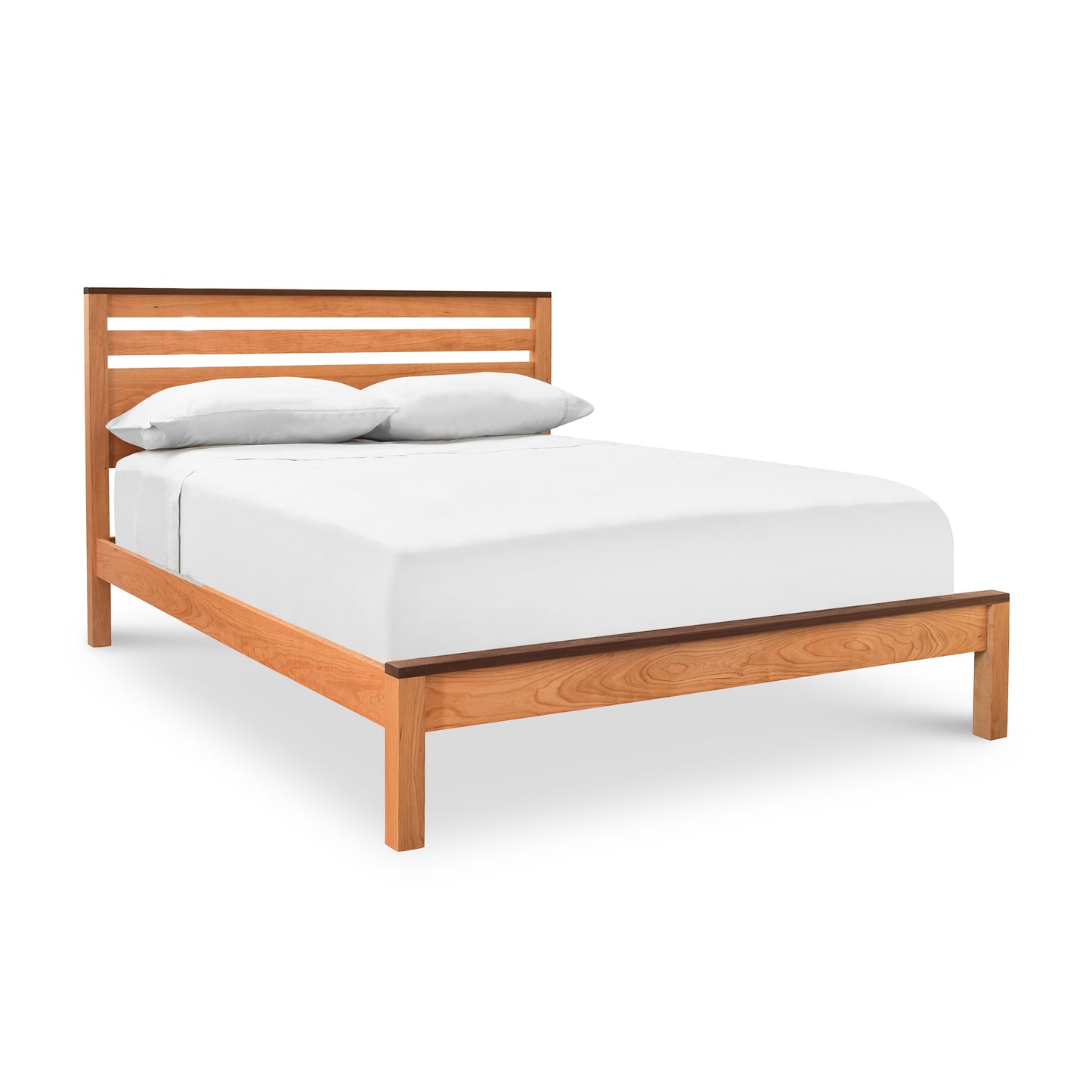 The Vermont Furniture Designs Skyline Panel Bed, handmade-to-order with a natural eco-friendly hand-rubbed oil finish, is elegantly adorned with white sheets.