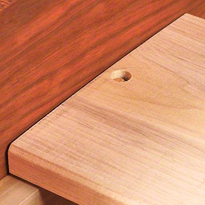 A piece of wood with a hole in it.