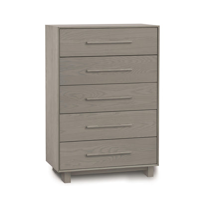 A Sloane 5-Drawer Wide Chest by Copeland Furniture, in wooden gray finish, on a plain white background, offering ample storage space.