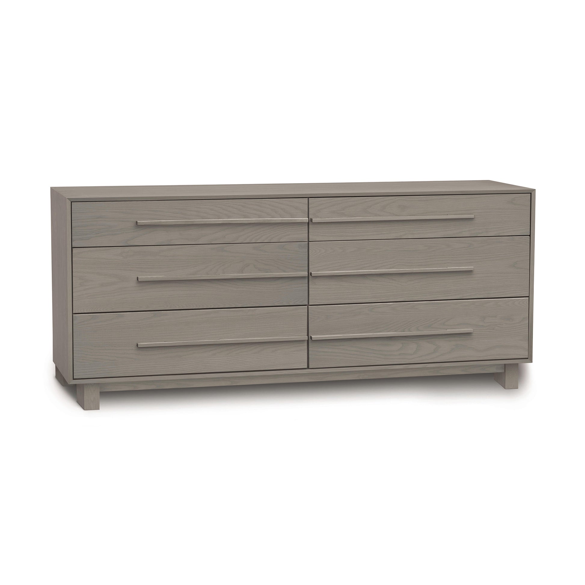 The Sloane 6-Drawer Dresser by Copeland Furniture, a modern bedroom piece, stands elegantly against a white background.