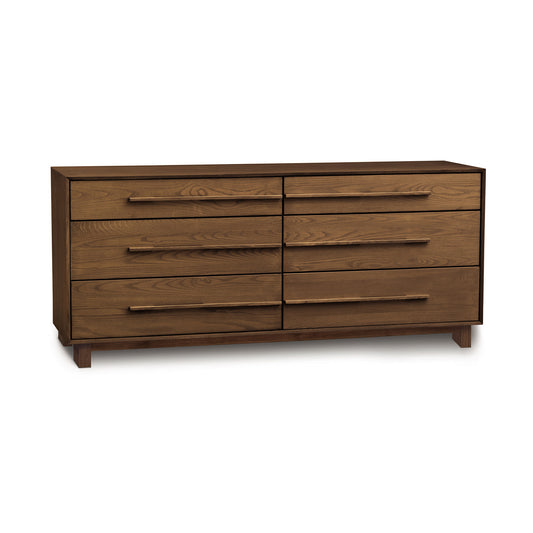The modern Sloane 6-Drawer Dresser from Copeland Furniture, crafted from sleek wood, features multiple drawers and is presented on a crisp white background.