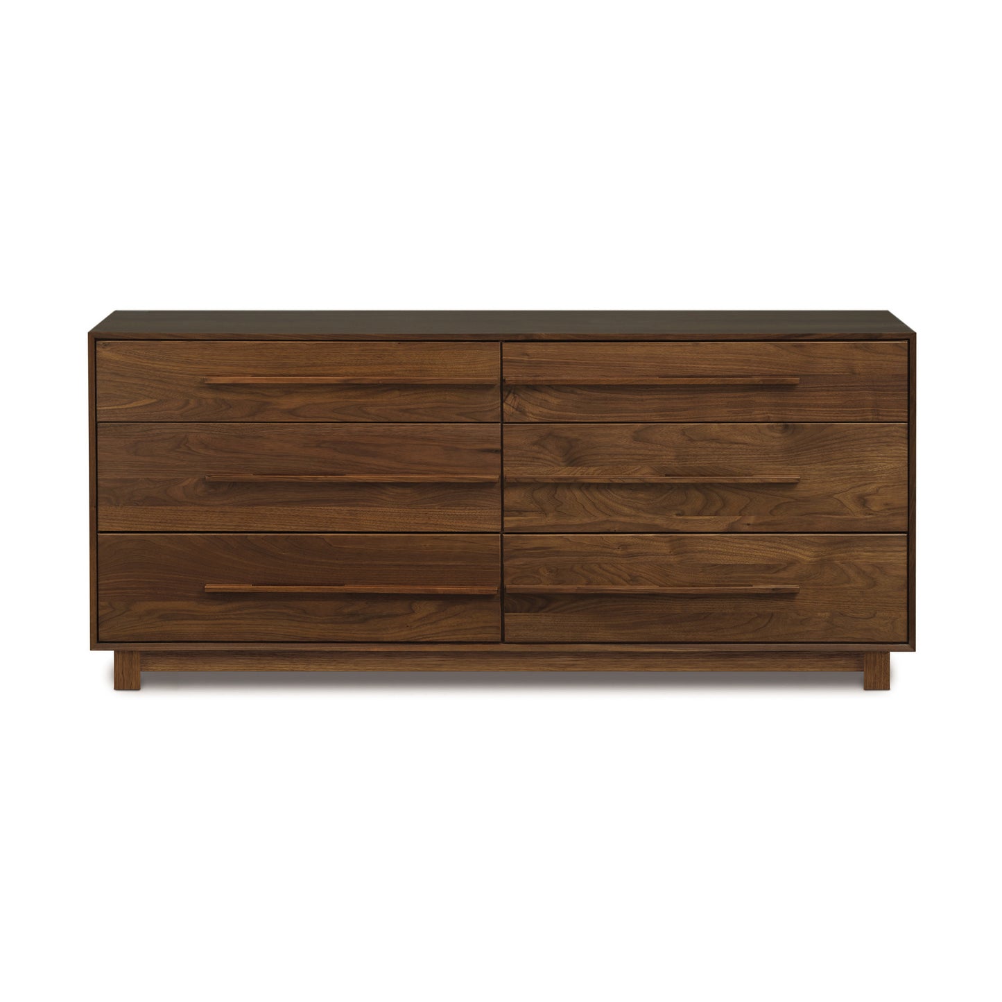 The Sloane 6-Drawer Dresser, a modern walnut dresser with four drawers, is the perfect addition to any modern bedroom. It is manufactured by Copeland Furniture.