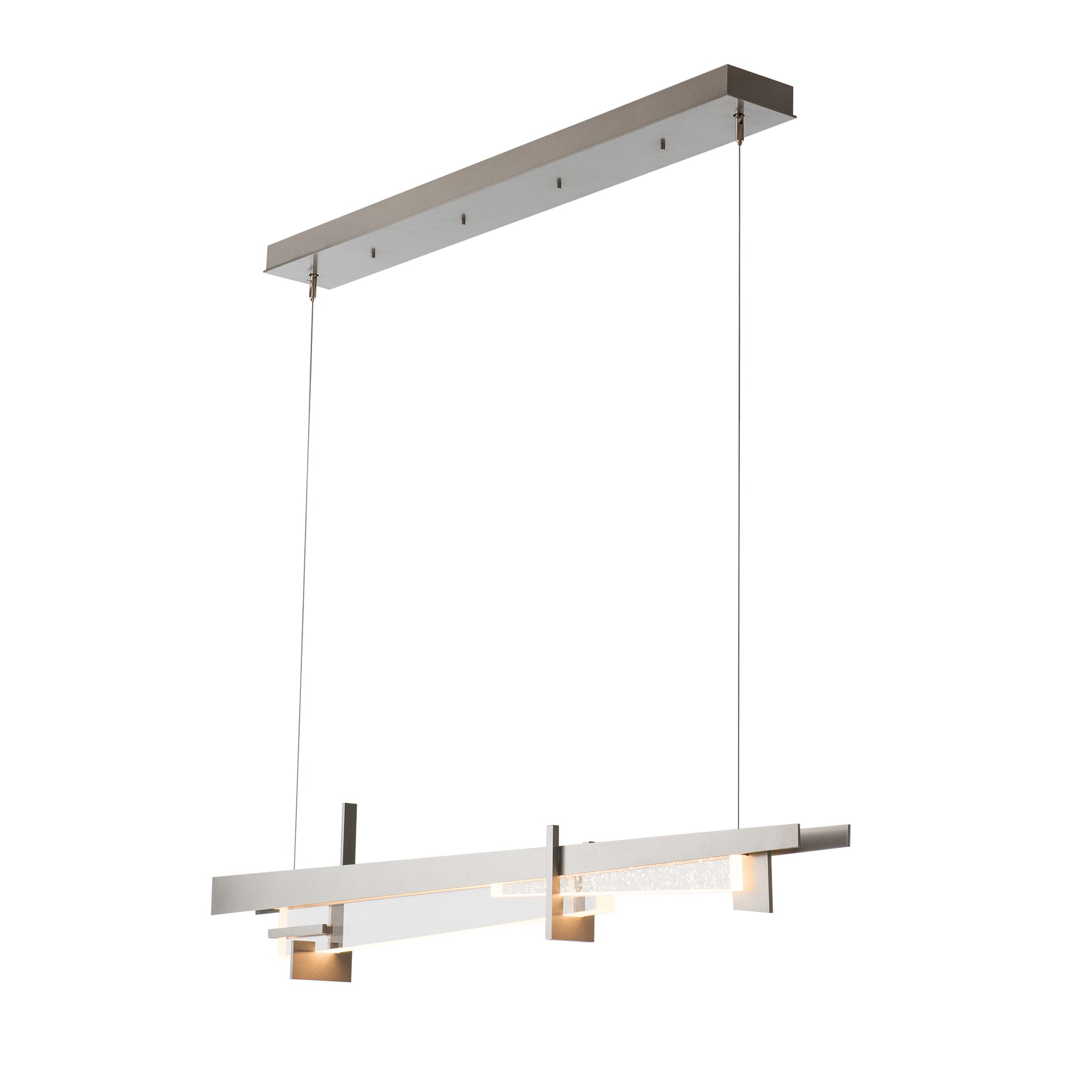 A handcrafted Hubbardton Forge Tenon LED pendant featuring three lights hanging from it.