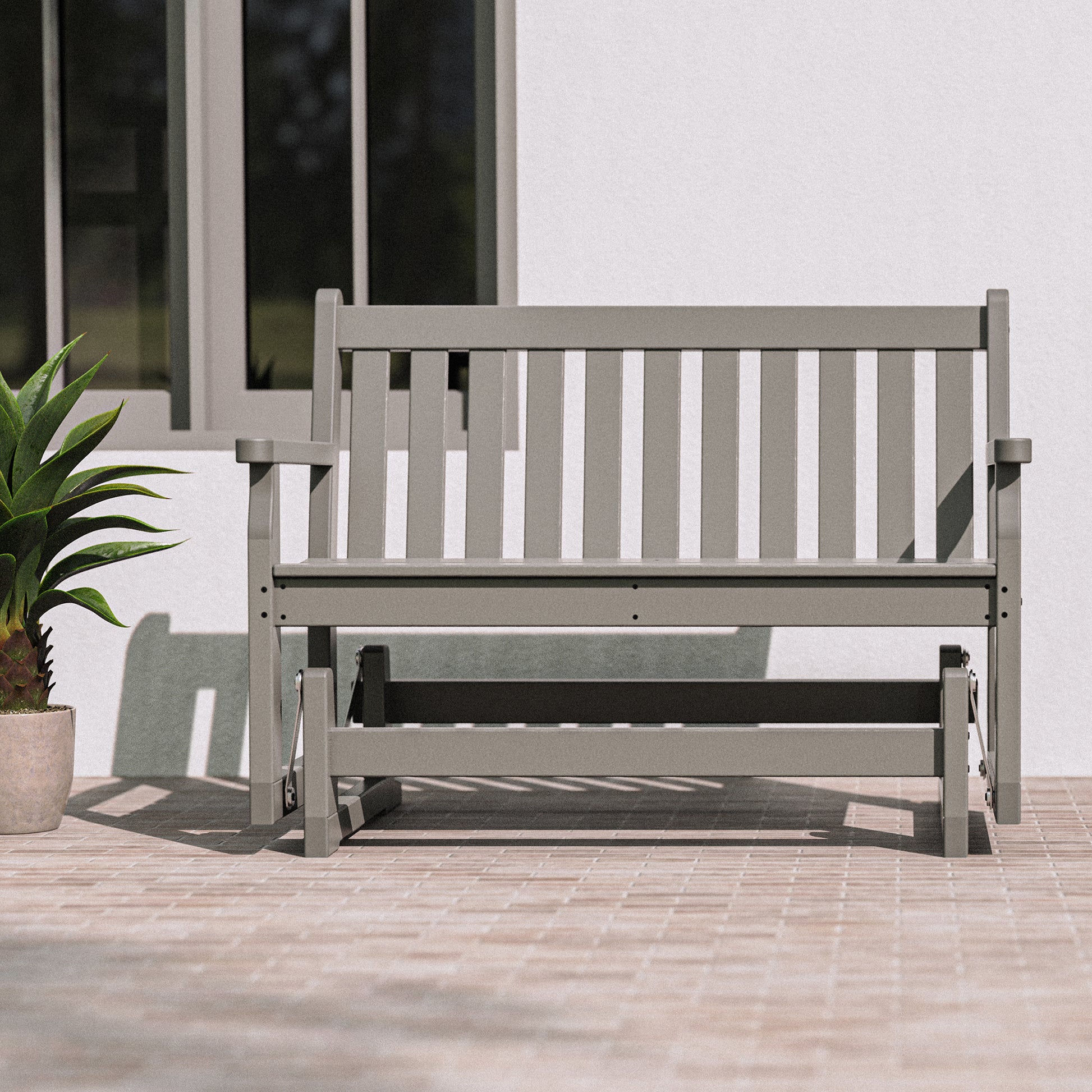 Gray POLYWOOD Traditional Garden 48" Glider Bench showcasing durable, American-made craftsmanship and classic design.