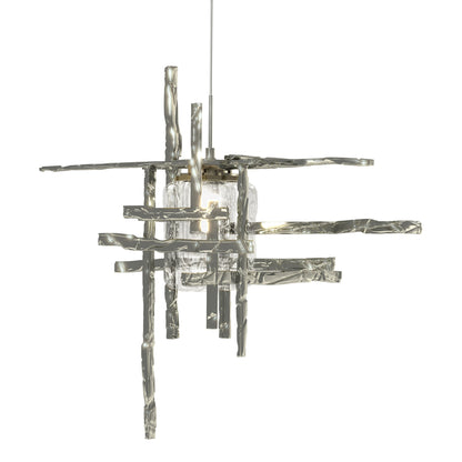 Close-up of the Tura Seeded Glass Low Voltage Mini Pendant by Hubbardton Forge, highlighting its modern geometric bars and clear textured glass.