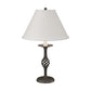 Twist Basket Table Lamp by Hubbardton Forge with a distinctive twisted metal base and white tapered shade, showcasing elegant American made craftsmanship.