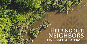 An aerial view of a river partially surrounded by green vegetation is on the left. On the right, the text reads, "Helping our neighbors one sale at a time." The background has a transparent pattern resembling leaves.