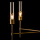 Two Hubbardton Forge Vela 5-Arm Chandeliers on a black background.