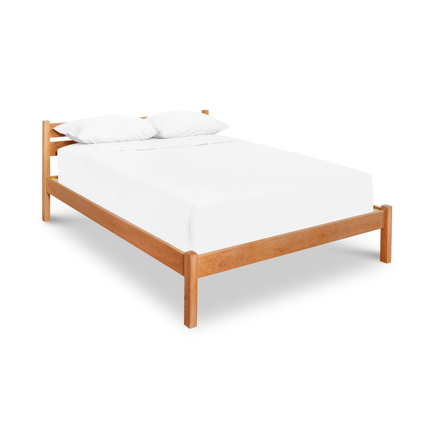 Vergennes Platform Bed by Vermont Furniture Designs, minimalist design in eco-friendly solid wood with white mattress and pillows.