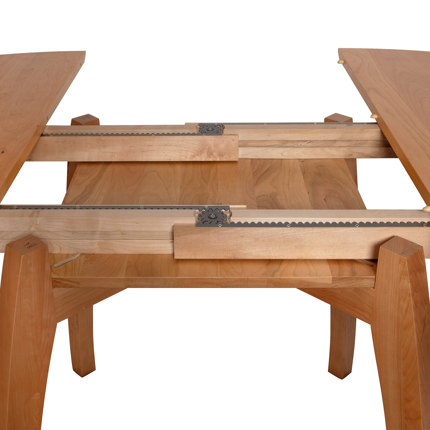 A wooden table with a fold out table top.