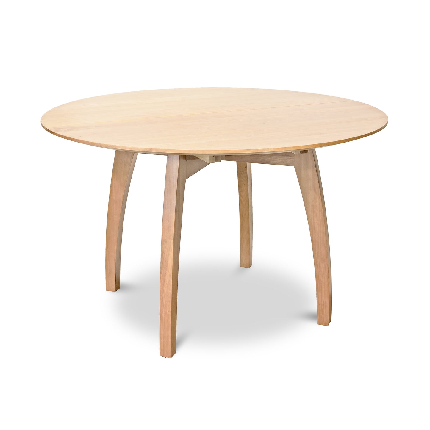 Handcrafted Lyndon Furniture Vermont Modern Round Pedestal Extension Table with light finish and four curved legs.