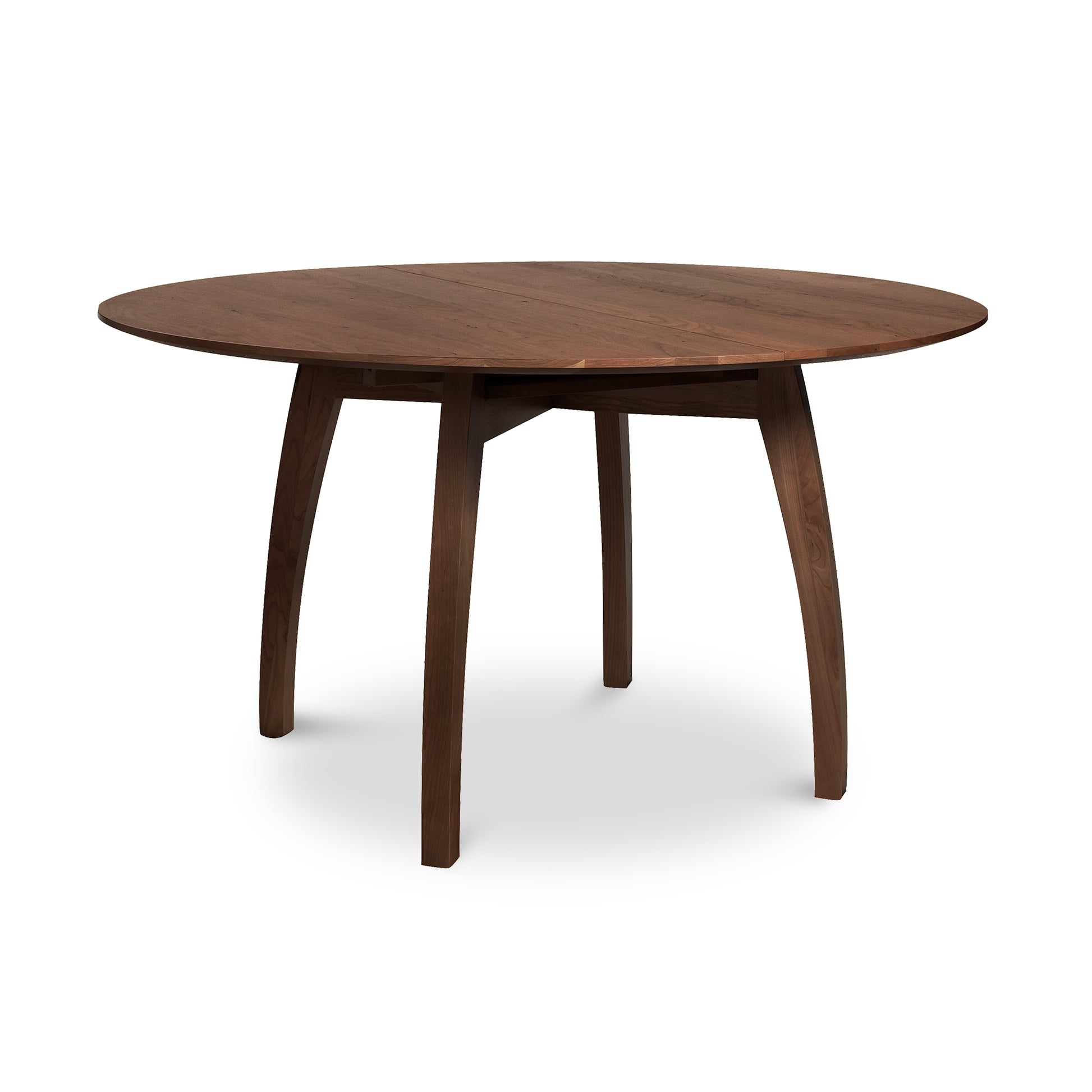 Vermont Modern Round Pedestal Extension Table with a smooth surface and gently curved legs by Lyndon Furniture.