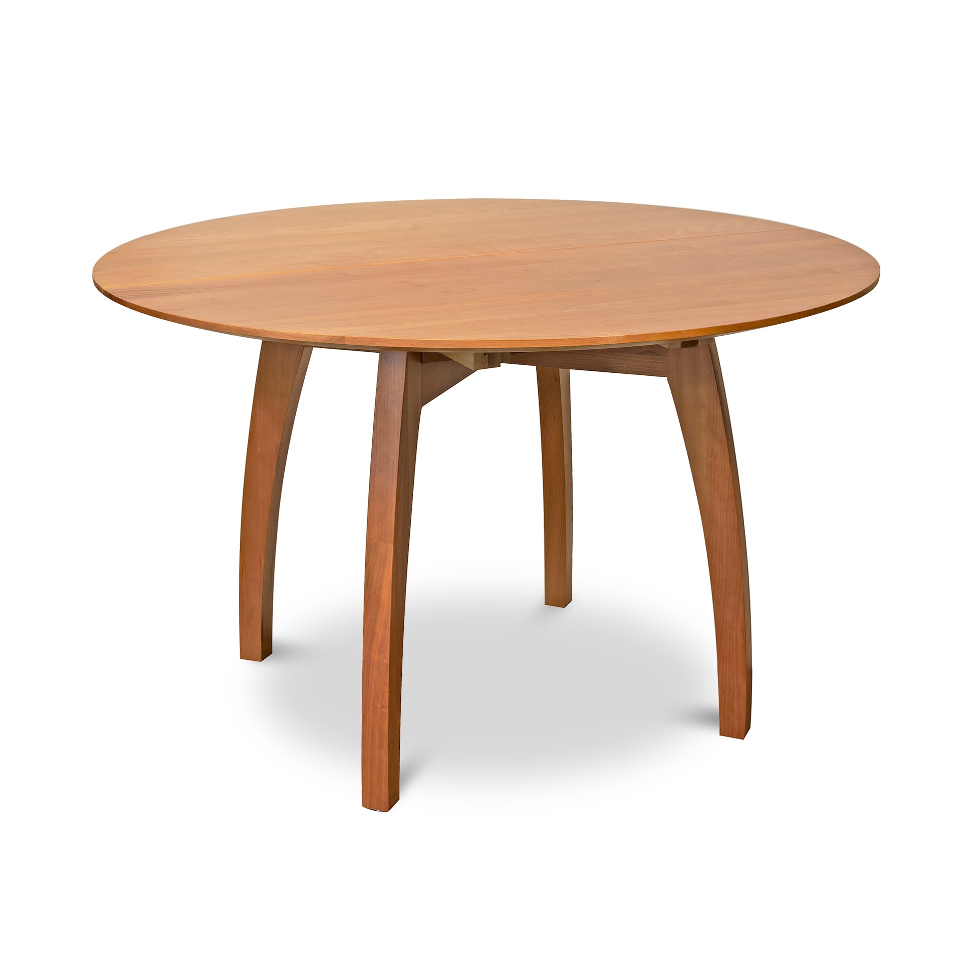 Vermont Modern Round Pedestal Extension Table by Lyndon Furniture showcasing solid wood construction with four elegantly curved legs.