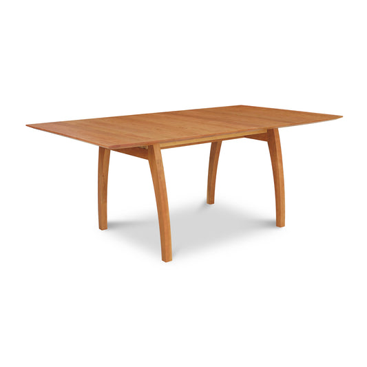 A high-end Lyndon Furniture Vermont Modern Extension Trestle Table with a wooden top.