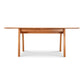 Lyndon Furniture Vermont Modern Extension Trestle Table in solid cherry, showcasing a sleek design.