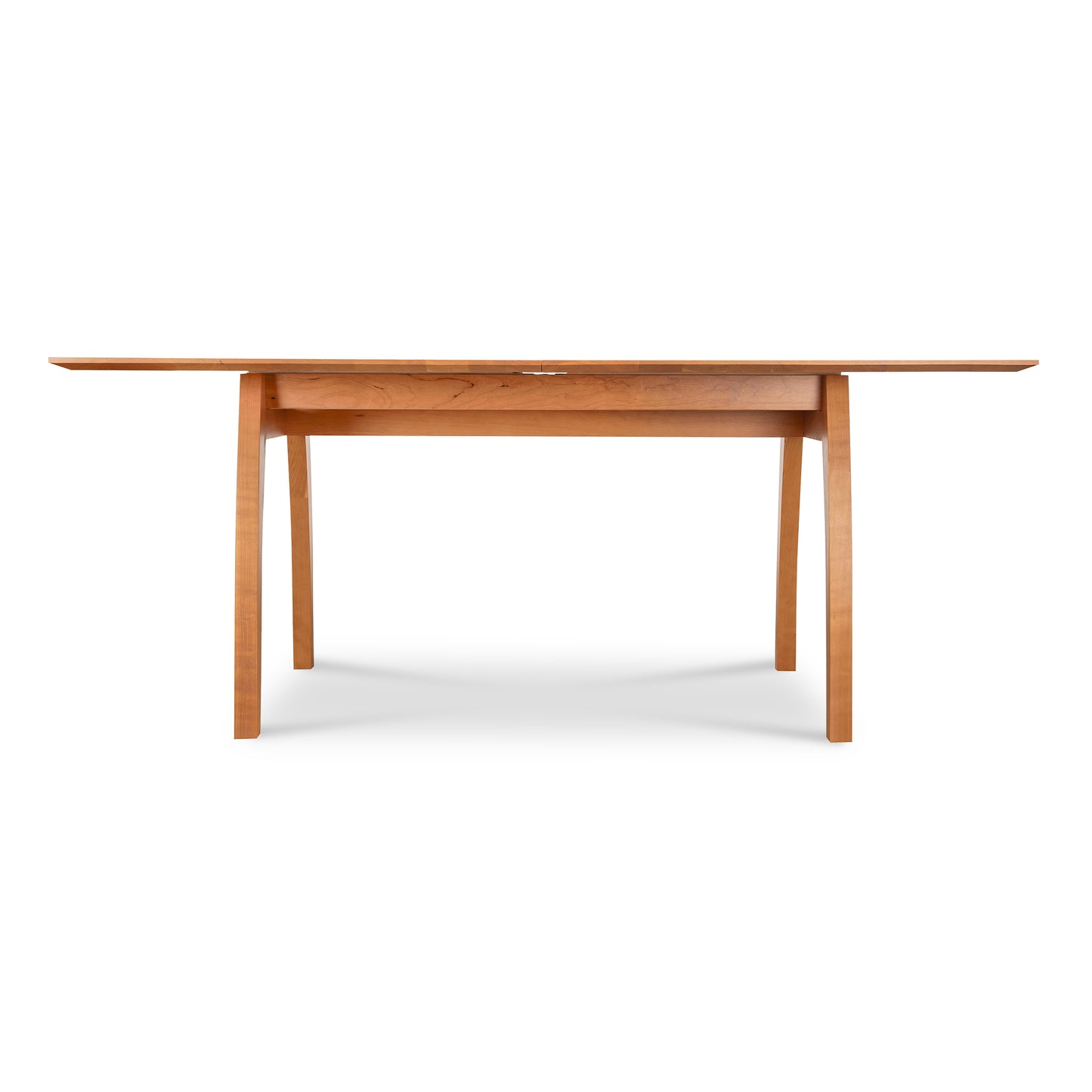 Lyndon Furniture Vermont Modern Extension Trestle Table in solid cherry, showcasing a sleek design.