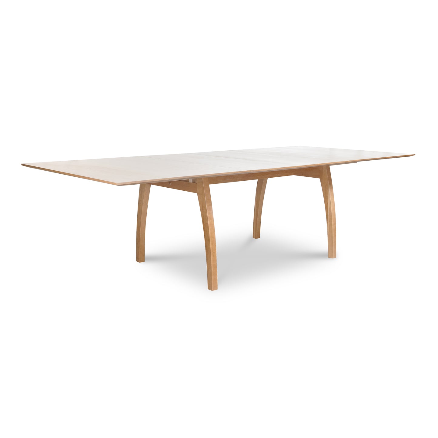 Vermont Modern Extension Trestle Table with curved legs and light cherry top by Lyndon Furniture.