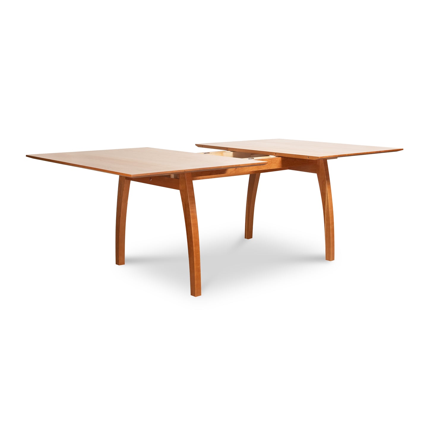 Lyndon Furniture Vermont Modern Extension Trestle Table with light brown finish and partially extended solid cherry leaf, showcasing elegant craftsmanship and modern design.