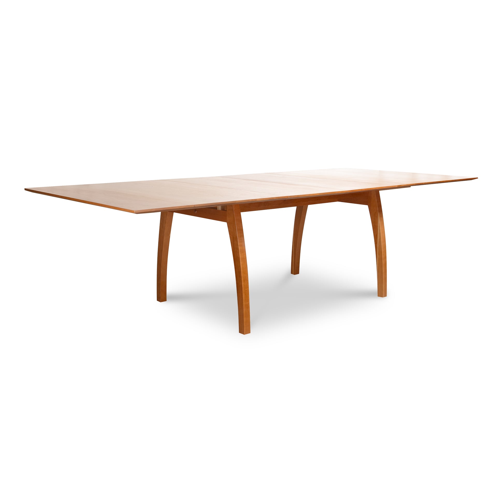 Lyndon Furniture Vermont Modern Extension Trestle Table in 48"x72" size with curved legs and extension leaves, showcasing sleek modern craftsmanship.