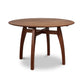 An organic Vermont Modern Round Solid Top Pedestal Table, handmade with two legs and a wooden top, by Lyndon Furniture.