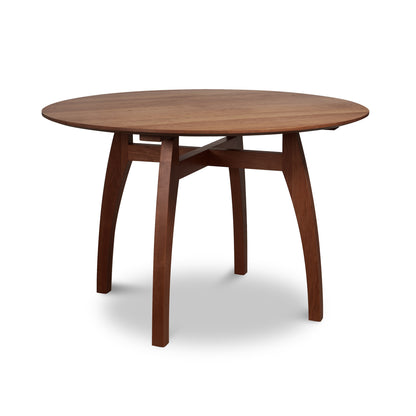 Lyndon Furniture Vermont Modern Round Solid Top Pedestal Table with four curved legs and crossbeam, crafted from solid wood.