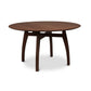 A Vermont Modern Round Solid Top Pedestal Table by Lyndon Furniture with an organic wood base.