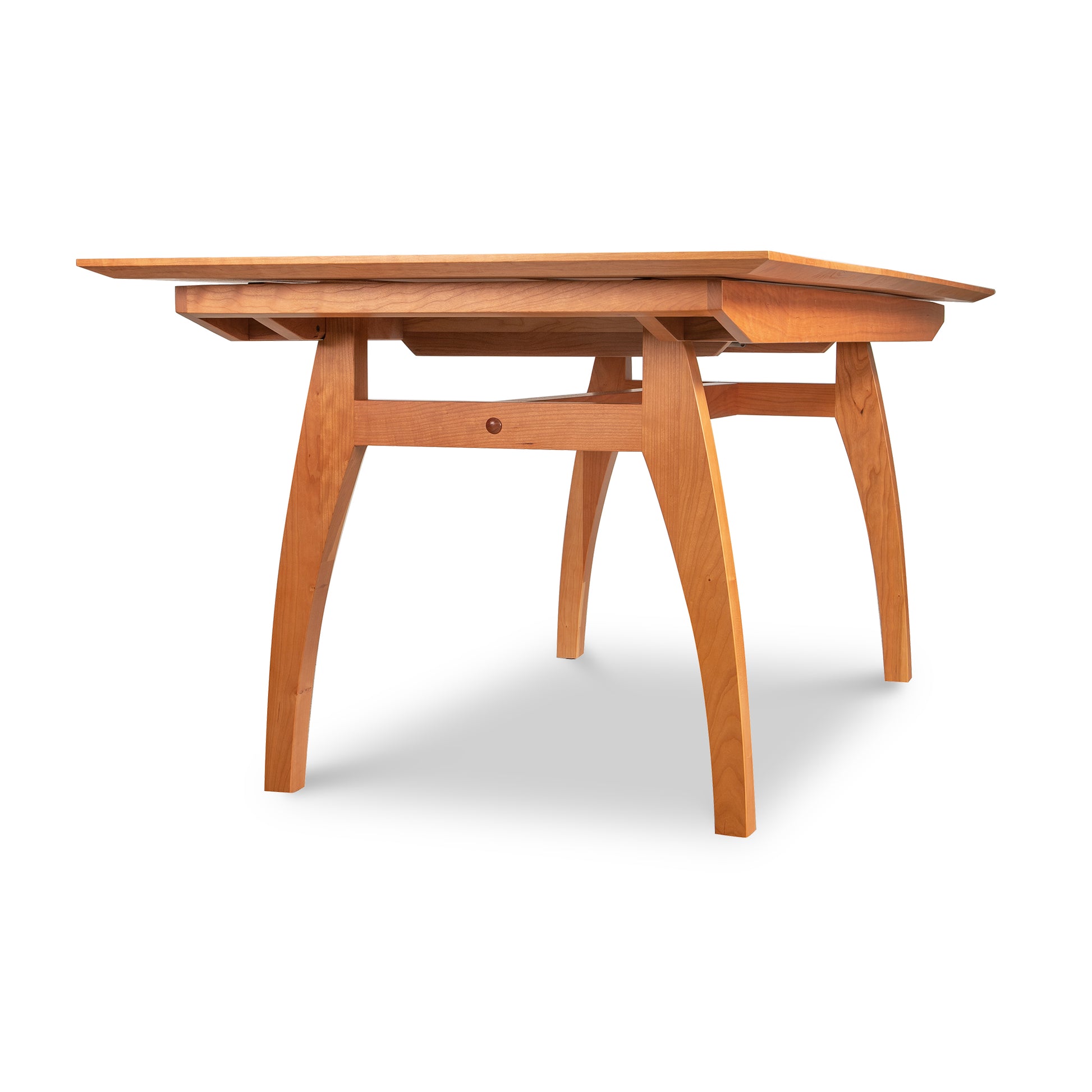 A Lyndon Furniture Vermont Modern Butterfly Extension Table with a high-end wooden top and legs.