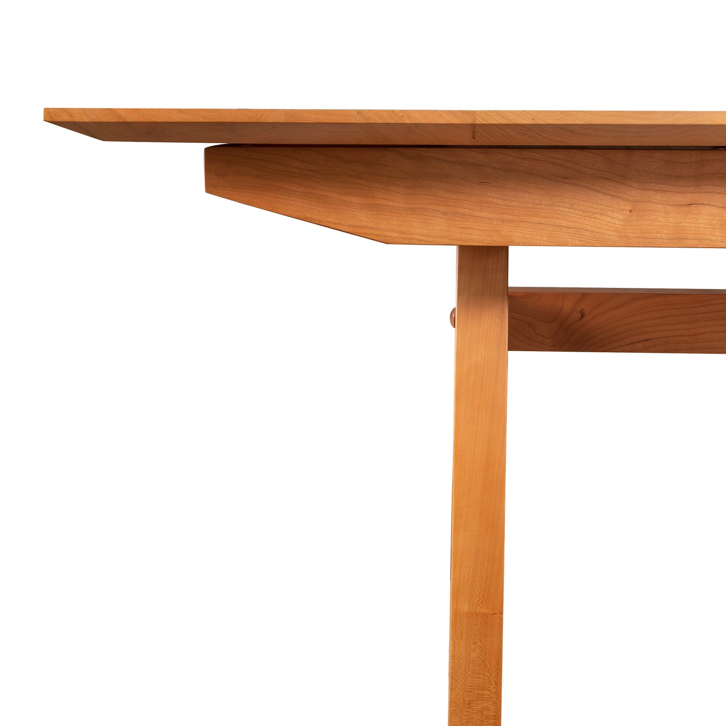A high-end Lyndon Furniture Vermont Modern Butterfly Extension Table with a wooden top and legs.