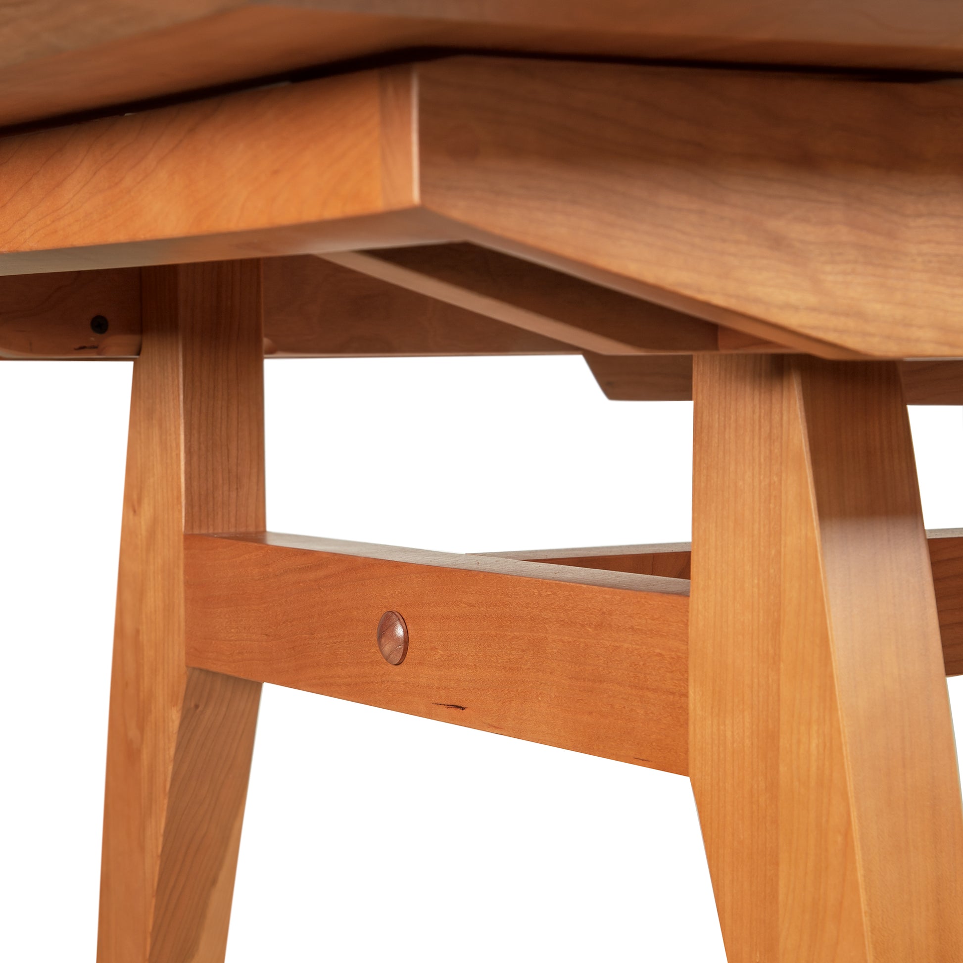 A high-end close up of a Lyndon Furniture Vermont Modern Butterfly Extension Table.