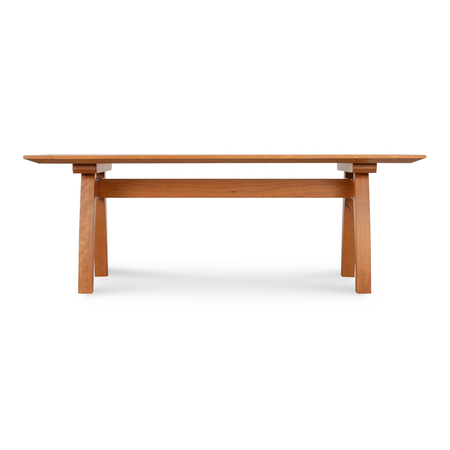 Minimalist Vermont Modern Trestle Coffee Table with rectangular top and angled legs, crafted from sustainably sourced solid wood by Lyndon Furniture.